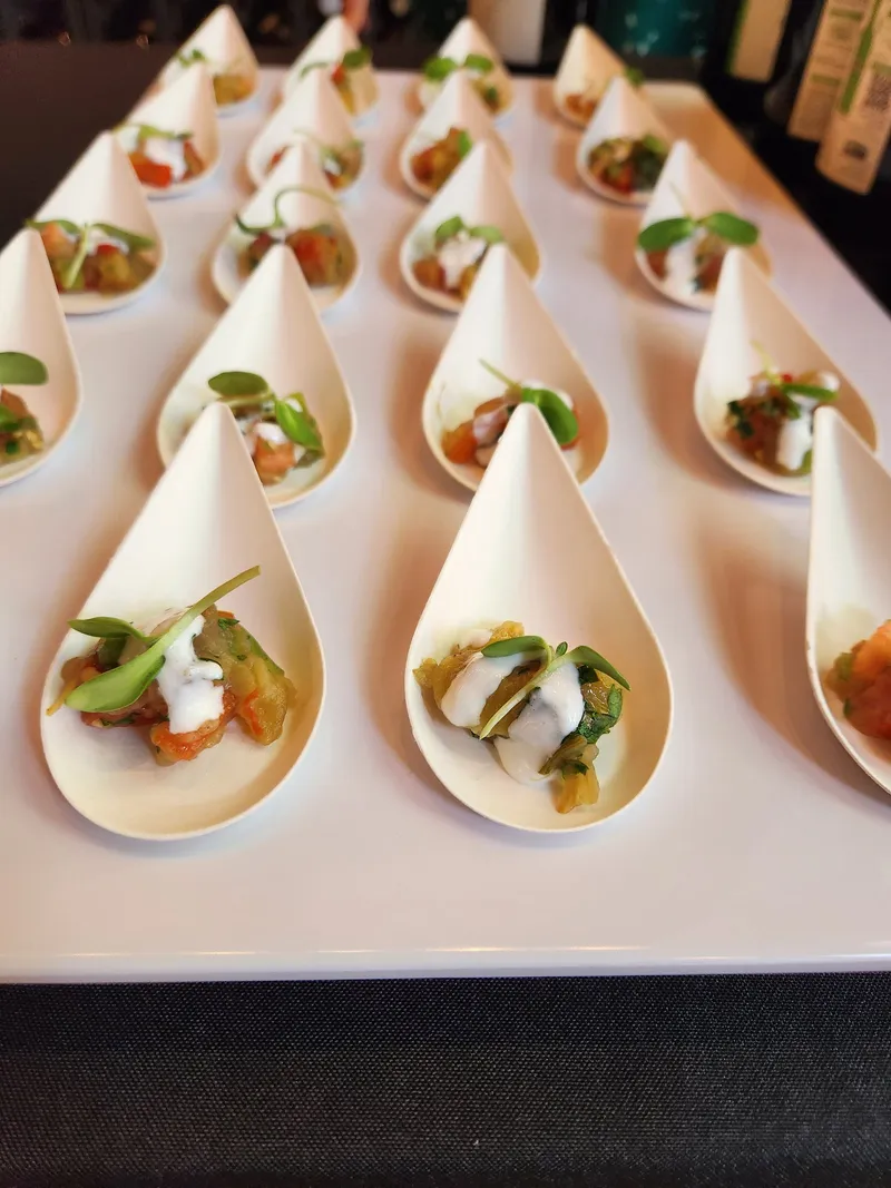 Rows of tasting spoons plated for an event