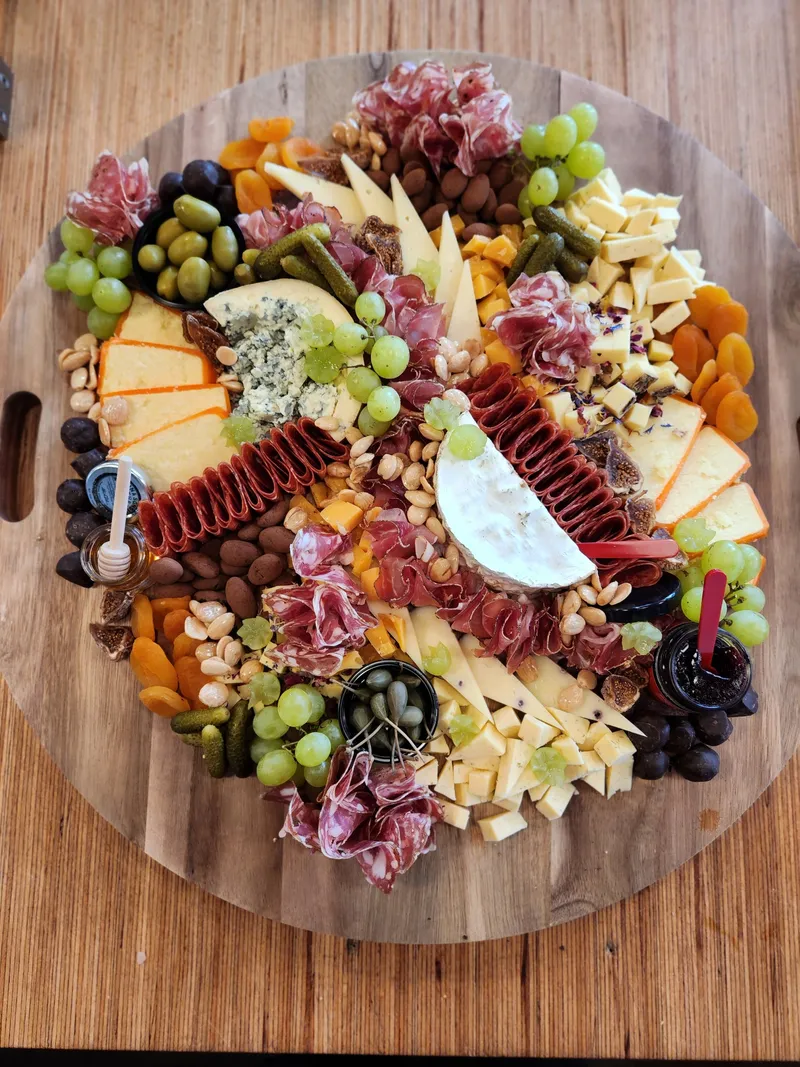 Charcuterie and cheese board with fruit and nuts